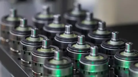 Getty Images A tray of actuators that look like small electric motors