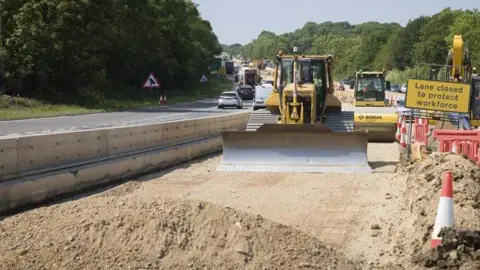 National Highways workers preparing for the new road surface