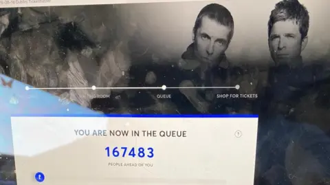 Screenshot of Oasis Ticketmaster queue saying '167,483 people ahead of you'