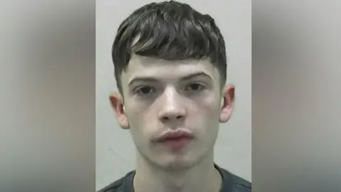 Northumbria Police Mugshot of Ben Grenfell. He has short wavy dark hair