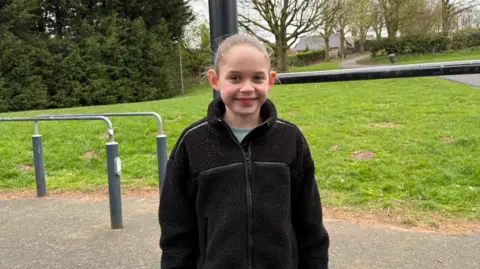 Thea Robinson stood next to outdoor gym