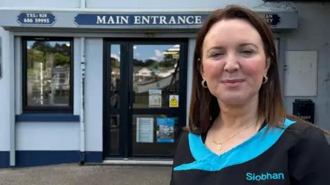 BBC Siobhan McNulty standing outside her pharmacy