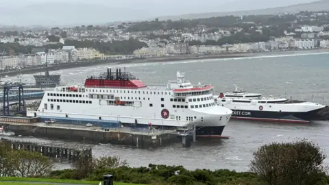 The Manxman, a large boxy ferry, andthe Manannan a sleek catameran are moored up in Douglas Harbour.