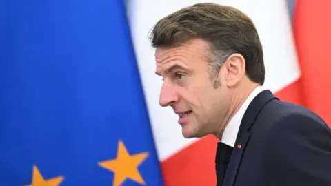 Serge Gapon / Agence France-Presse The French president passes in front of the European Union flag and the Polish flag hours before the name of the new prime minister is announced