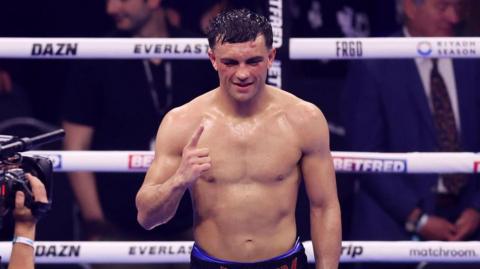 Jack Catterall celebrates after beating Josh Taylor