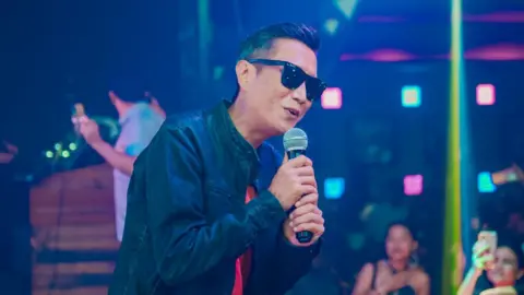 Prashant Tamang singing at a club.