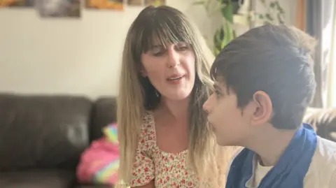 Claudia and her 9-year-old son Matei who eventually secured council funding for private physio because she claims Sirona let them down.