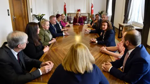 Welsh government A general view of the ministers of the Welsh government, sat at a brown table in the first minister's office in Cathays Park, Cardiff