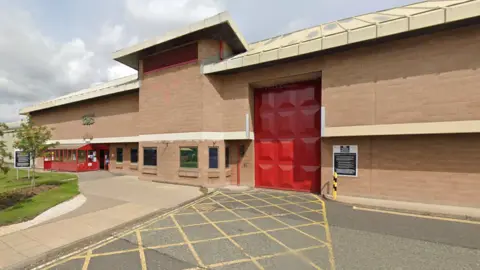 Google Maps A front view of HMP Holme House. It is a brick building with large red door
