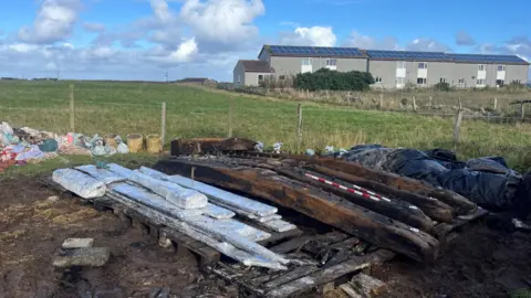 The shipwreck timbers next to the Heritage Centre on Sanday