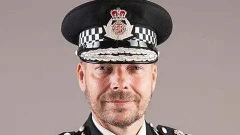 Rod Hansen wearing his police officer uniform. 