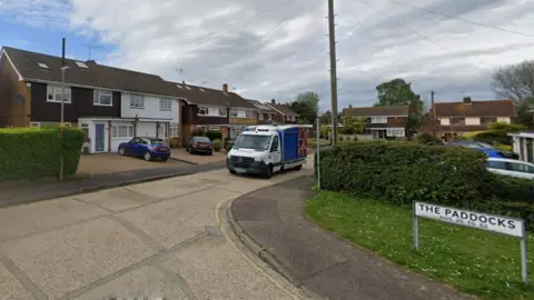 Google Residential cul de sac with houses, sign The Paddocks