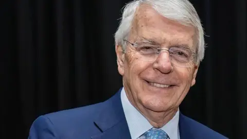 Sir John Major smiling
