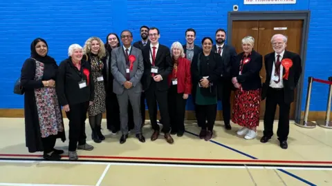 Paul Hutchingson/BBC Mohammad Yasin and his Labour team