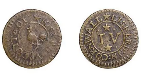 A picture of the front and back of a coin. The coin on the left is brown in colour and has an animal in the middle. The coin on the right says Liskeard in Cornwall running around the edge of the coin.