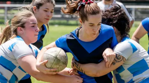 women playing rugby