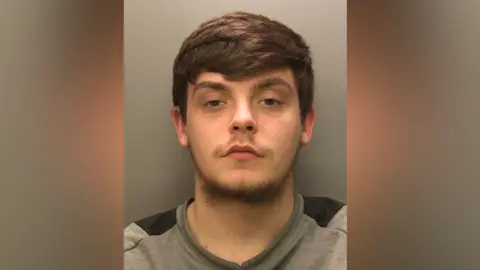 Police photo of Jack Lowrey, 21, who attempted to get away from police by driving at just 10mph. He was handed an immediate 12 month prison sentence.