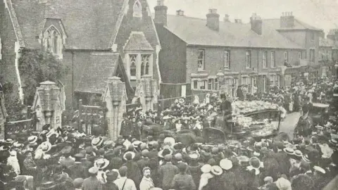 London Standard Mary Money's funeral on October 3, 1905. The black and white image shows a huge number of people congregating at a church. 
