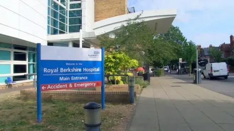 A general view outside the Royal Berkshire Hospital, with a road on the right side. 