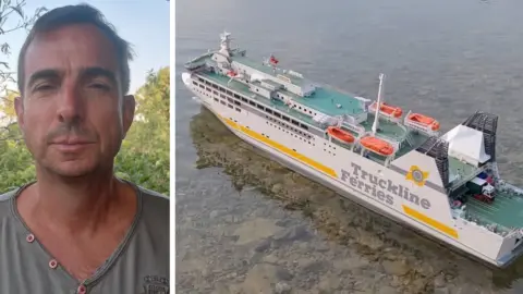 Sylvain Pierre Sylvain Pierre with a model of the ferry with the words Truckline Ferries on its side, floating in a shallow pond