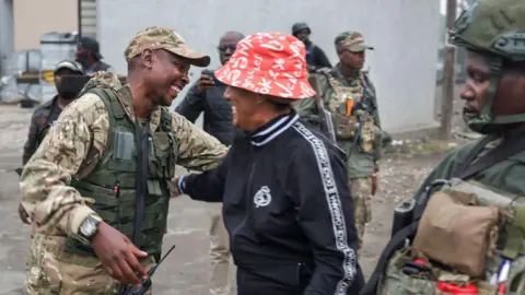 Men from Afrana from the military uniform who are the armed M23 members on Street in Guma on January 29, 2025. 