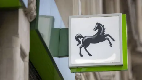 BBC A sign of Lloyds bank, which is a black horse rearing its head on two legs
