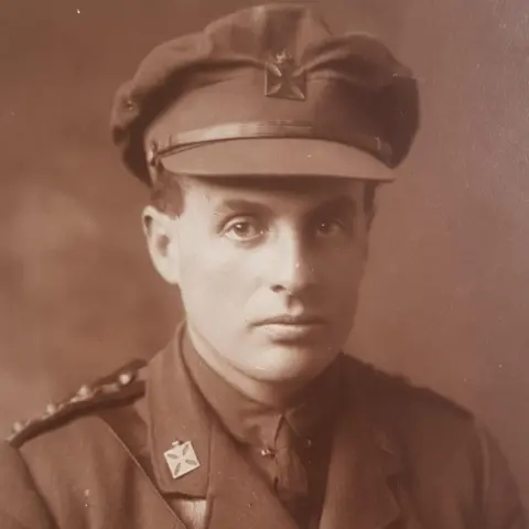 Family handout Sepia-toned image of the Reverend David Railton wearing an army uniform and cap