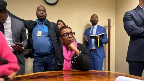 Congressional Black Caucus chair Yvette Clarke listens to lawmakers address a CBC press conference 