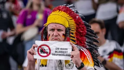 Kevin Voigt/Getty Images This fan's assessment was: "Our train service is an embarrassment to Germany"