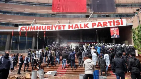 EPA Riot police fired tear gas as they forced their way into the CHP's headquarters