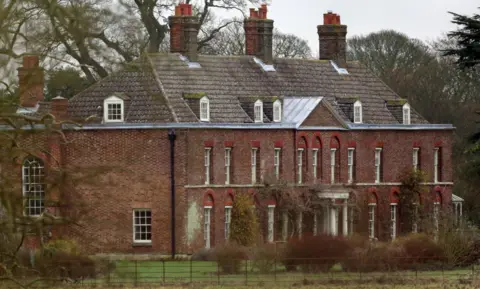 PA Media A large red brick country manor house 