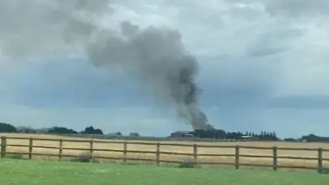 Submitted Smoke rising from a barn fire in Catwick, East Yorkshire