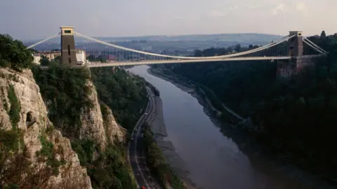 Getty Images A library picture of Clifton Suspension Bridge, taken from the air, showing the river below and a road winding alongside.