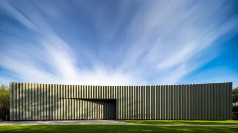 A modern zinc clad building designed to look like traditional Cornish vernacular.