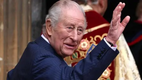 King Charles waves to well-wishers at St George's Chapel in Windsor