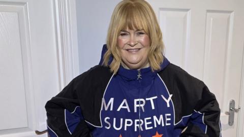 Susan Boyle poses in her new jacket