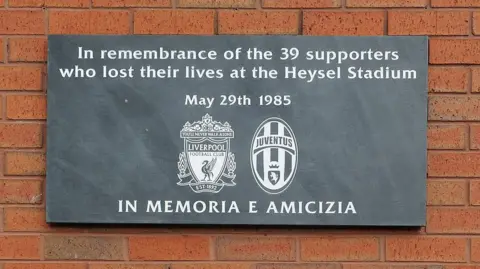 The current Heysel memorial plaque at Anfield’s Sir Kenny Dalglish Stand will be replaced