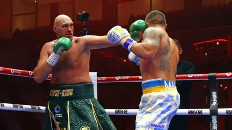 Getty Images Ukraine's Oleksandr Usyk (R) fights against Britain's Tyson Fury during a heavyweight boxing world championship fight at Kingdom Arena in Riyadh, Saudi Arabia on May 19, 2024. Oleksandr Usyk beat Tyson Fury by split decision to win the world's first undisputed heavyweight championship in 25 years on May 19, 2024, an unprecedented feat in boxing's four-belt era.