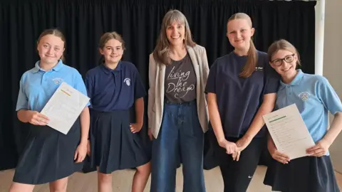 Cornerstone workshop leader Laura Howells-Green with students
