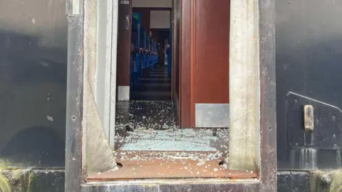 This image shows glass on the floor of one of the vintage steam trains 