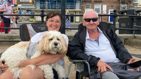 BBC/Fiona Callow A couple in their 60s with their dog