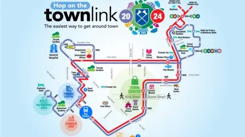 Government of Jersey A map showing roads and bus routes. It shows keys areas such as "bus station" and "town church". It says "Hope on the townlink. The easiest way to get around town." The map is on a light blue background. 