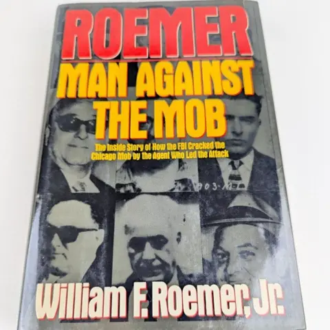 Penguin Books The front cover of the book ' Man Against The Mob'. It depicts images of various Chicago gangsters. 