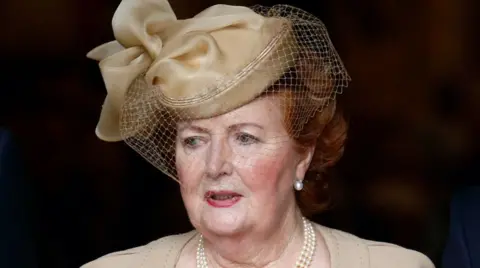 Getty Images Lady Helen Wogan successful  a chapeau  astatine  Sir Terry's memorial service