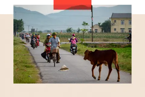 Jonathan Head People on bikes in Nghe An 