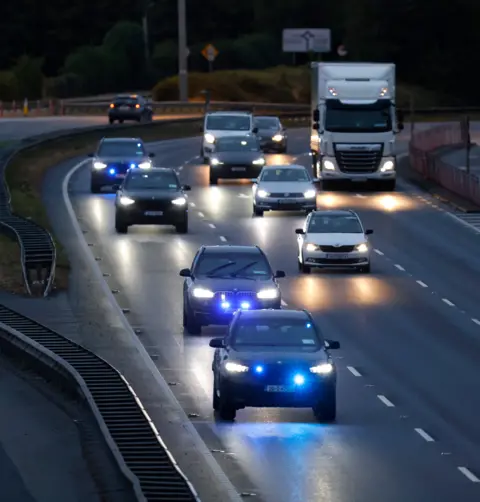 PA Media Numerous police cars on motorway