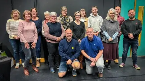 States of Guernsey A group picture of the 14 new community governors. 