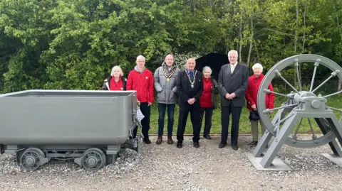 Broxtowe Borough Council Broxtowe Borough Council, Eastwood Town Council and the Friends of Colliers Wood in front of the new mine car and pulley wheel display