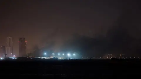 Smoe is seen rising from the US operated naval base in Bahrain at night.