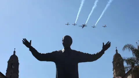 EPA Aircraft performed a fly-by over the statue of former South African president Nelson Mandela